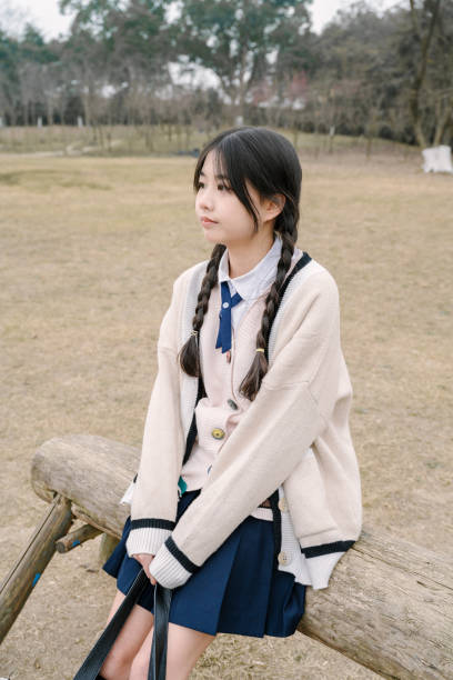 istock A young girl resting on the grass 1370802945