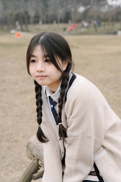 istock A young girl resting on the grass 1370802950