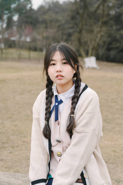 istock A young girl resting on the grass 1370802979