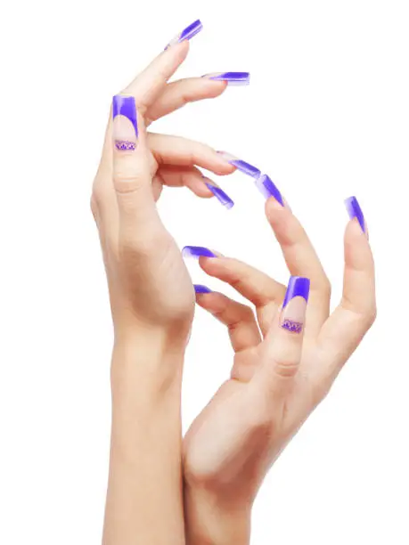 Hands with blue french acrylic nails manicure and painting isolated  on white background