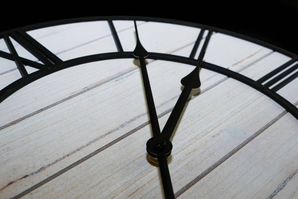 Old antique clock face and hands close-up detail. Old antique clock face and hands close-up detail. Left angle view. color image roman numeral rusty time stock pictures, royalty-free photos & images