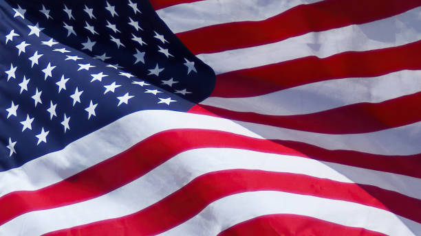 close up of the us flag waving in the wind - american flag imagens e fotografias de stock