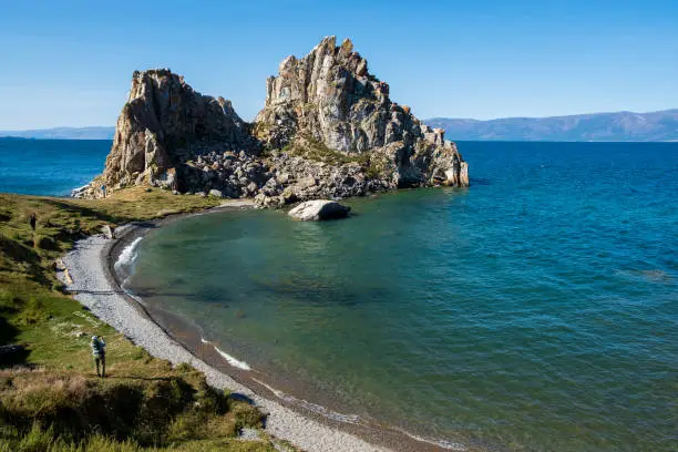 Shamanka Rock on lake Baikal near Khuzhir village at Olkhon island in September, Siberia, Russia. Lake Baikal is the deepest freshwater lake in the world