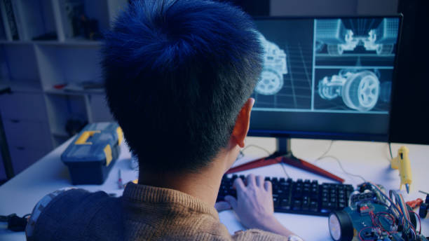 istock Asian teenager doing open-source hardware and software robot homework project in house 1370823418