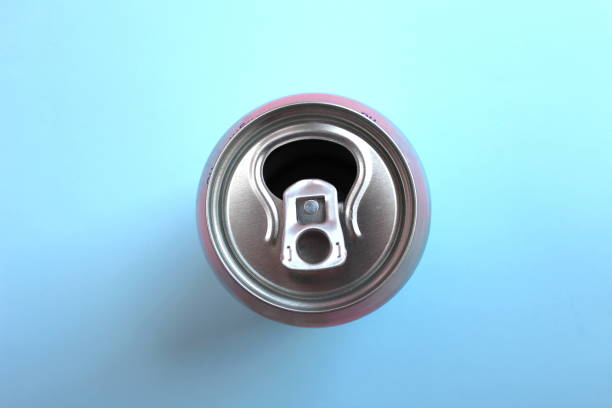 Open empty aluminum can top view on blue background Open empty aluminum can top view on blue background can top stock pictures, royalty-free photos & images