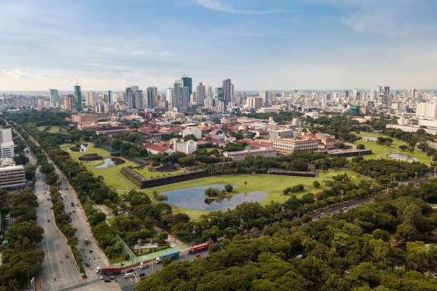 manila, philippines - aerial of intramuros, a historic walled area. surrounded by golf courses, and buildings. intersection of roxas blvd and padre burgos ave in front.. - manila imagens e fotografias de stock