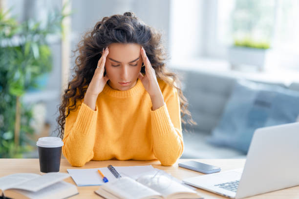 istock woman working on laptop at home. 1370830959
