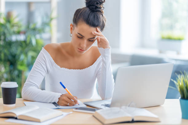 istock woman working on laptop at home. 1370831040