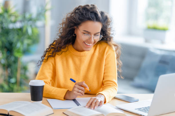 istock woman working on laptop at home. 1370831092