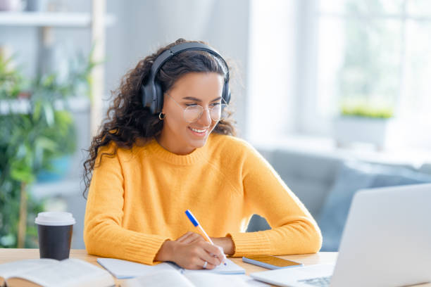 istock woman working on laptop at home. 1370831123