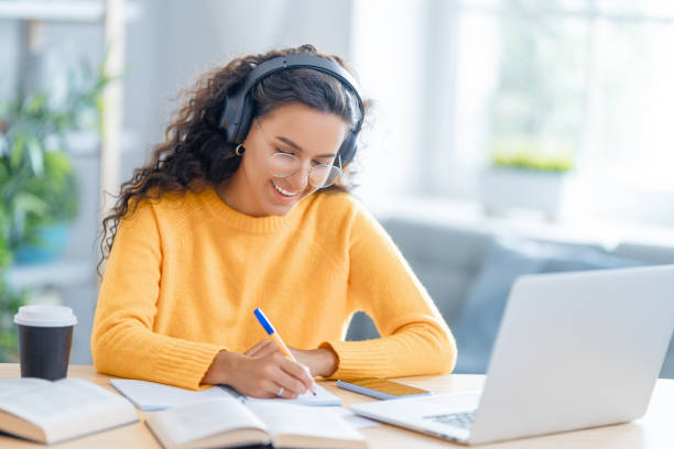 istock woman working on laptop at home. 1370831208