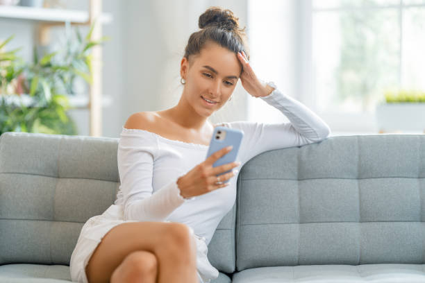 istock Young woman is using phone for video call 1370831248