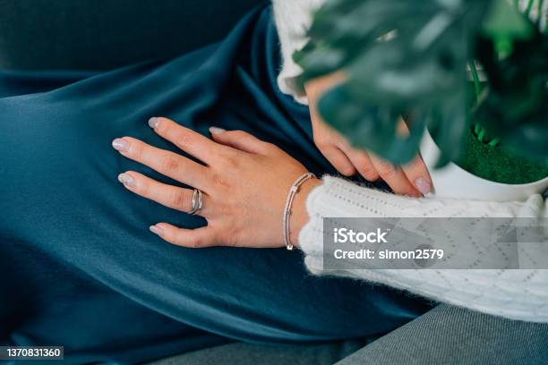 Woman Holding A Flower Pot With Luxury Accessories Such As Diamond Ring And Silver Bracelet Stock Photo - Download Image Now