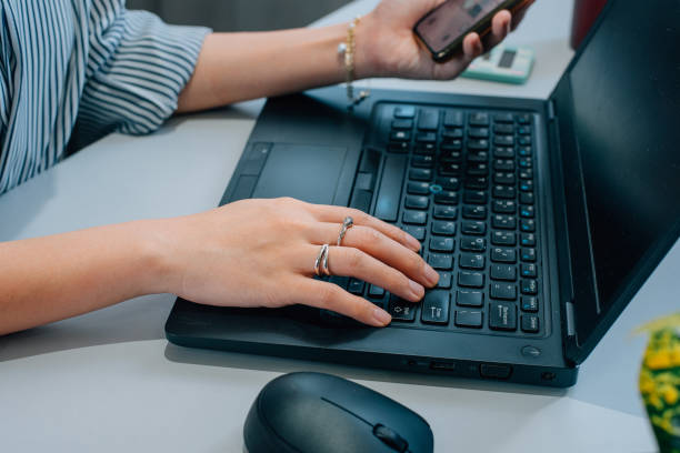 istock Fashionable woman working with notebook 1370832279