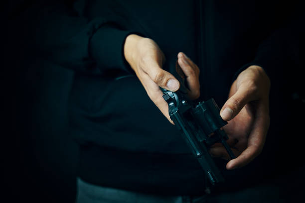 istock Close up of man reloading revolver. 1370833072