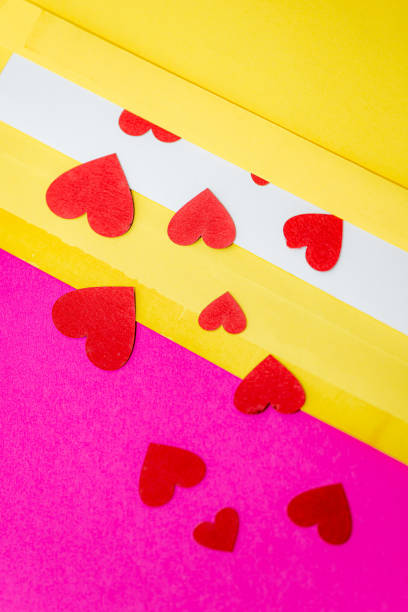 istock red little hearts coming out from envelope isolated on pink background with copy space, loveletter concept 1370837301