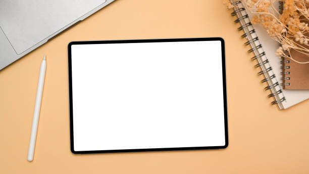 istock Home office table desk with tablet touchpad white screen mockup 1370838444