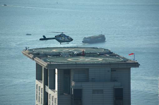 Helicopter landing on the Peninsula Hotel in Tsim Sha Tsui district, Hong Kong