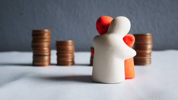 istock People hug on coin background. 1370841640