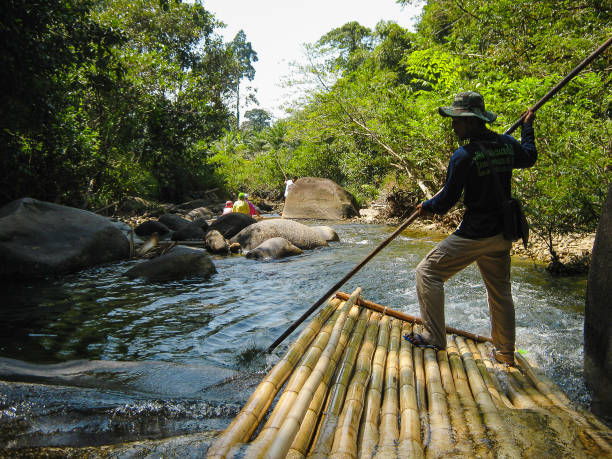 River rafting in the Thai jungle over a bamboo bundle. Calm river, very beautiful.