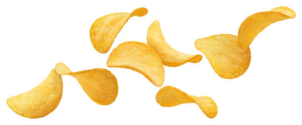 Flying potato chips on white Flying potato chips, isolated on white background potato chip stock pictures, royalty-free photos & images