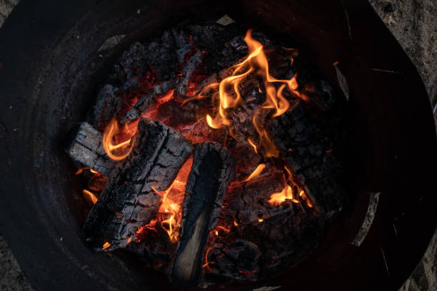 istock top view of an orange flame in an old iron barrel 1370851171