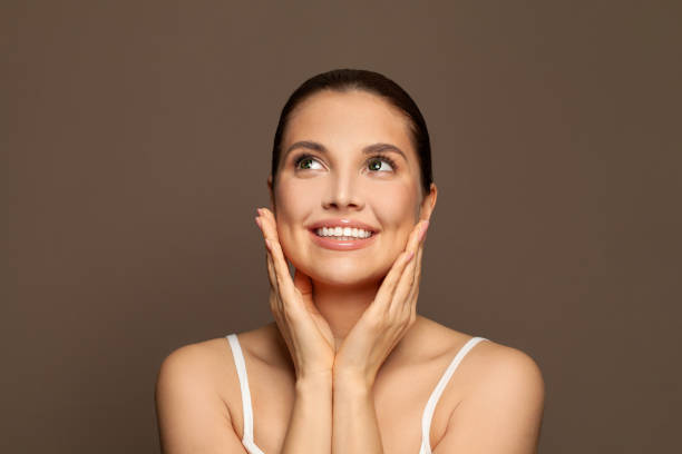 istock Healthy spa model woman looking away on brown background 1370852329