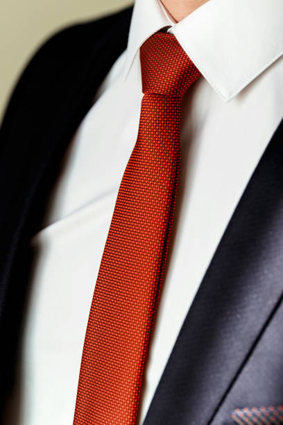 istock red silk tie and a business suit 1370855467