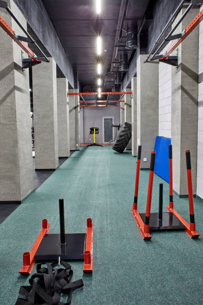 istock Special modern equipment for physical training in spacious, well lit, empty gym interior. Sport, fitness 1370857496