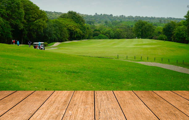 istock Wooden floor and golf course background. 1370857510