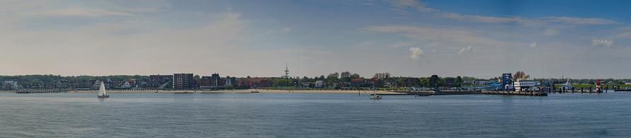Panoramic view of the coastal landscape with the beach and port of Wyk auf Föhr from a ferry. North Sea island in North Frisia, Schleswig-Holstein.