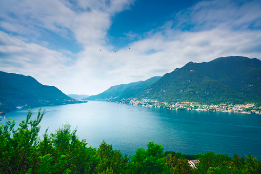 Como Lake landscape. Aerial view, trees, water and mountains. Italy, Europe.