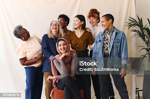 istock Portrait of cheerful mixed age range multi ethnic women celebrating International Women's Day 1370858710