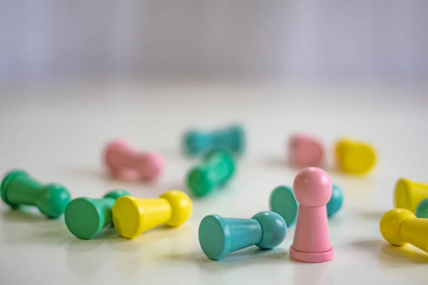 istock Standing winner and other fallen pawns 1370859054