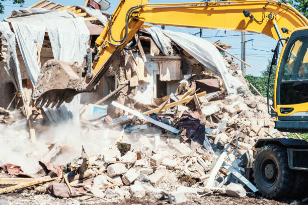 istock Excavator breaks old house. Process of demolition building. Construction industry and development concept 1370861575