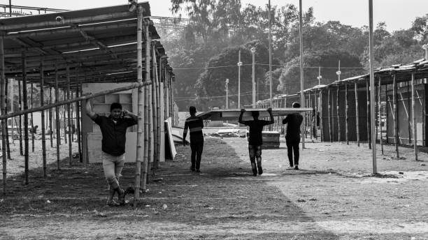 people working hard for the book fair 2022. this image was captured by me on february 9, 2022, from dhaka, bangladesh. - elon musk 個照片及圖片檔