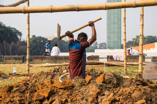People working hard for the book fair 2022. This image was captured by me on February 9, 2022, from Dhaka, Bangladesh. Preparation of book fair 2022, People working hard for the book fair 2022. This image was captured by me on February 9, 2022, from Dhaka, Bangladesh. elon musk photos stock pictures, royalty-free photos & images