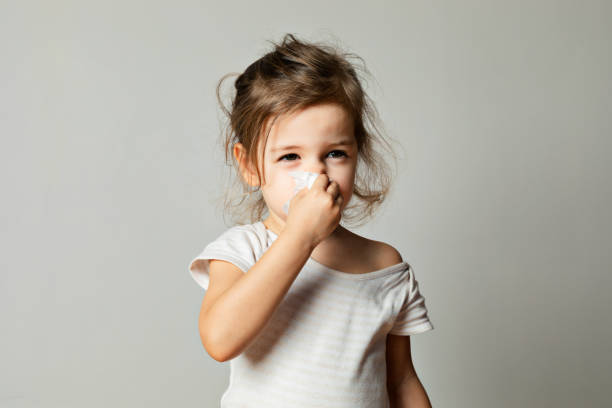 istock Little Girl Cleaning Her Nose 1370864548