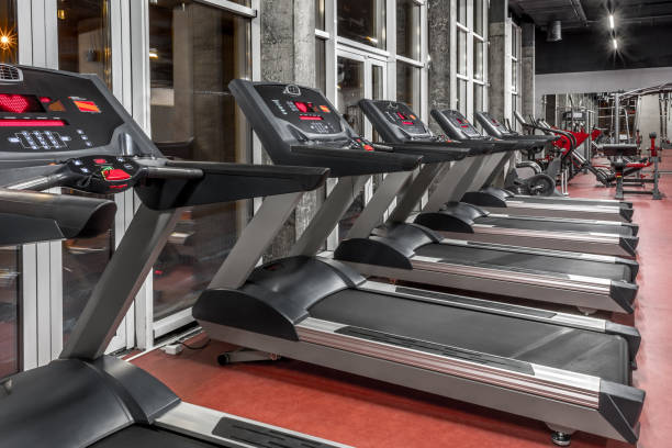 istock Lined contemporary speedwalks by the window in spacious, well lit, empty gym interior. Special modern equipment for physical training. Sport, fitness 1370864562