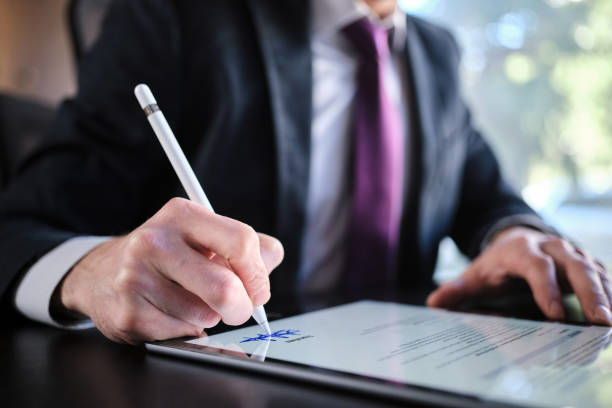 istock Man Signing The Digital Contract 1370864626