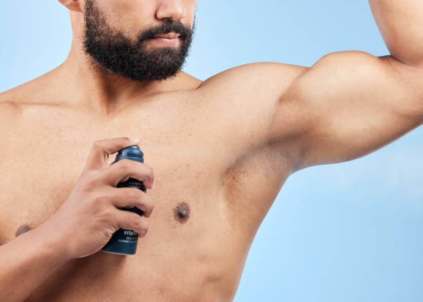 istock Studio shot of an unrecognizable man applying deodorant against a blue background 1370865066