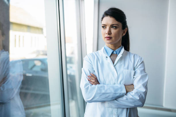 istock Young worried doctor looking at the results 1370867333