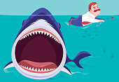istock big shark chasing businessman 1370867564