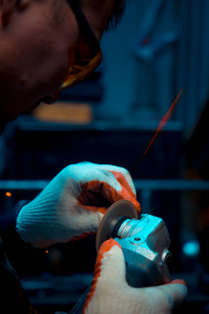 istock Locksmith man in gloves and yellow glasses at work 1370870441