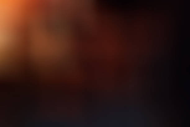istock Abstract  background, luminescence, shine red - black shade from the left top corner 1370870531