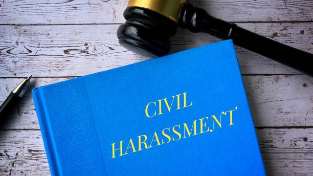 istock Civil harassment and gavel on a table. Law concept 1370871136