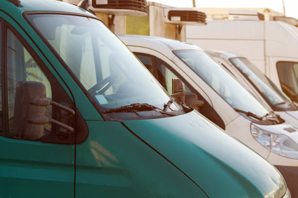 istock Minivans on parking lot 1370871891