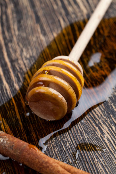 istock honey and honey spoons on a wooden table 1370873204
