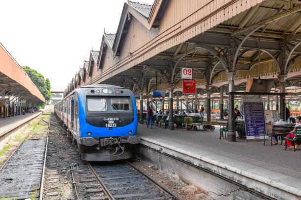 Trains pass at Colombo train station Colombo, Sri Lanka - February 04, 2020: Trains pass at Colombo train station colombo train stock pictures, royalty-free photos & images