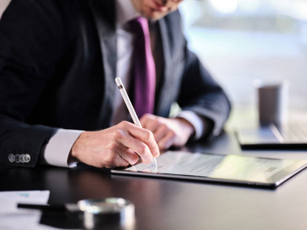 istock Man Signing The Digital Contract 1370873715